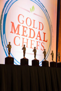 award trophies in front of Gold Medal Chefs sign
